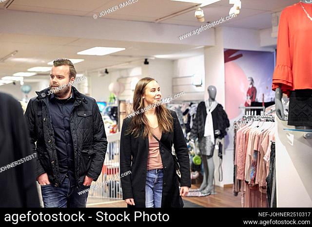 Young couple in clothes shop