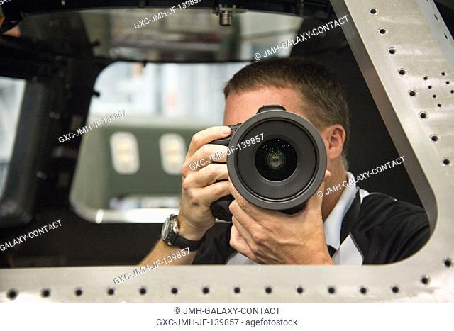 NASA astronaut Terry Virts, Expedition 42 flight engineer and Expedition 43 commander, participates in an IMAX cinematography training session in a Cupola...