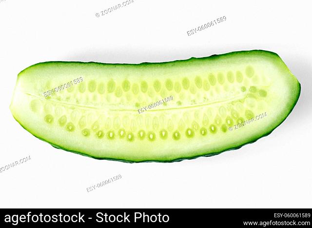 fresh ripe half cucumber cut on white background
