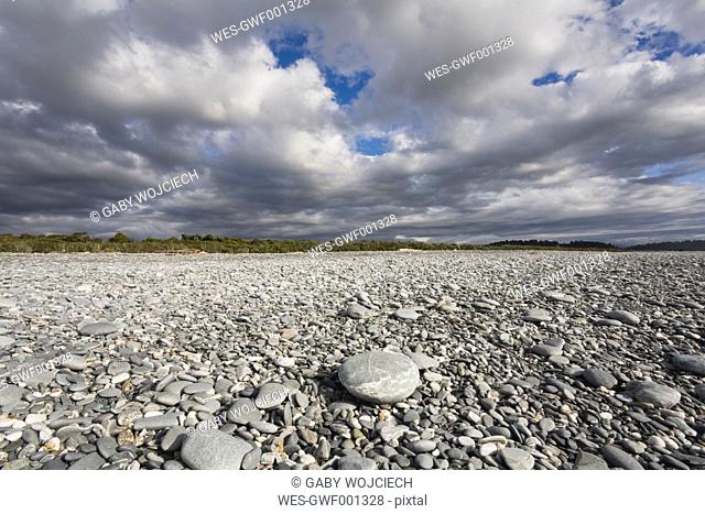 New Zealand, South Island, West Coast, View of Gillespies Beach with stones