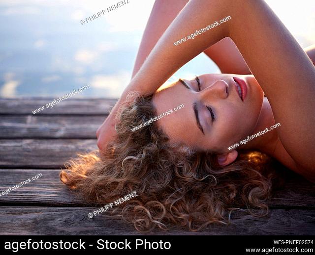 Beautiful woman relaxing on jetty
