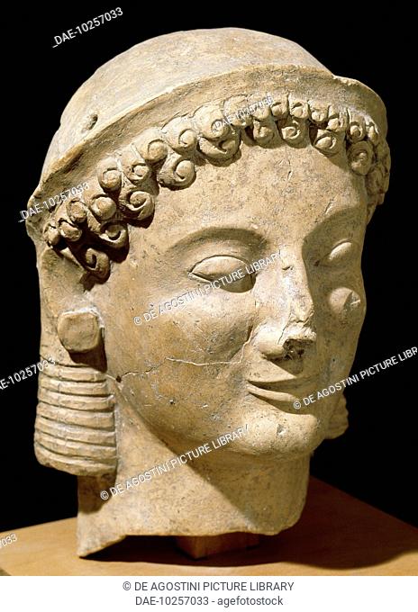 Terracotta female head, from the ancient city of Medma, Calabria, Italy. Greek civilisation, 6th-5th century BC.  Reggio Di Calabria