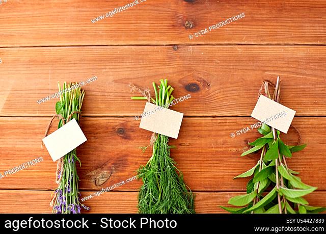 lavender, dill and peppermint on wooden background