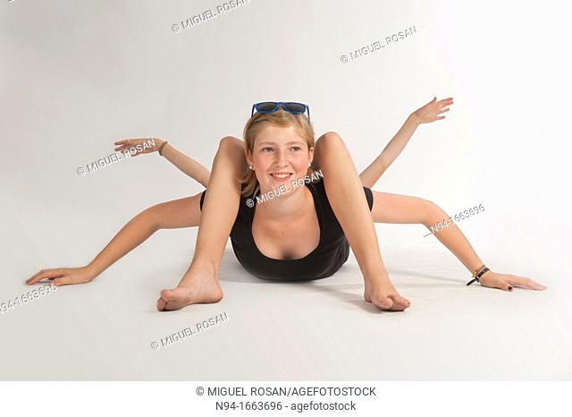 Blonde girl lying on the floor simulating bodily contortions