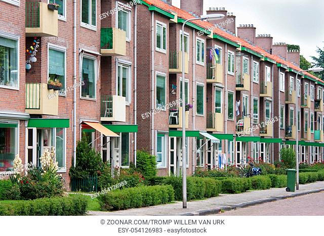 Typical Dutch residential street with flats