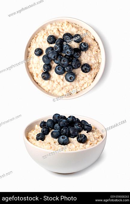 prepared oatmeal with berries isolated on white background