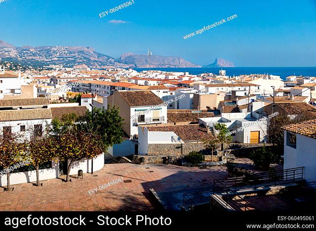 Outlook at the old town square Placa l'Aigua with sunny view over skyline and ocean with mountains and rock of Calpe, Altea, Costa Blanca, Spain