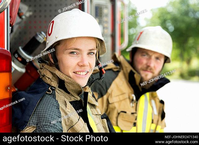 Firefighters in front of fire truck