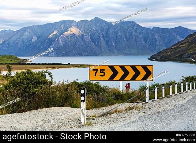 Guy with camera, Lake Hawea, Otago Region, Queenstown-Lakes District, South Island, New Zealand, Oceania