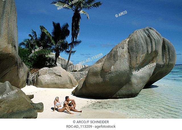Couple on tropical beach La Digue Island Seychelles