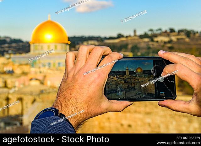 Person taking photos of of temple mount at old jersualem city