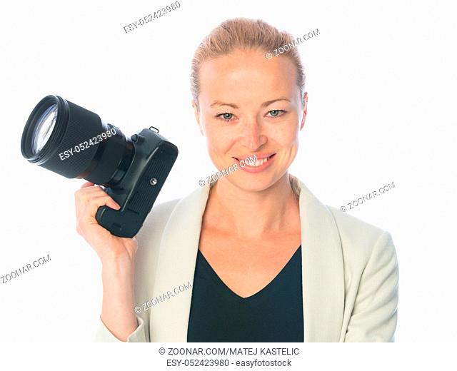 Woman photographer holding big dslr camera isolated on white background