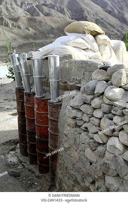 A grain storage made from discarded army drums and mud at SECMOL in Ladakh, India. The SECMOL Campus is located near the village of Phey in the Indus valley 18...