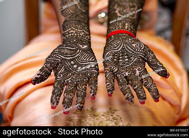 Hand of a Hindu bride painted with henna on the eve of her wedding in Beau-Bassin, Mauritius, Africa