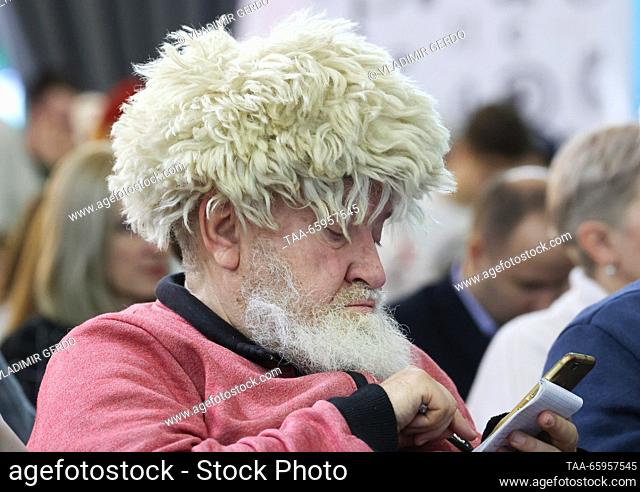 RUSSIA, MOSCOW - DECEMBER 21, 2023: A man attends the opening of Karelia Republic Day at the Russia Expo international exhibition and forum at the VDNKh...