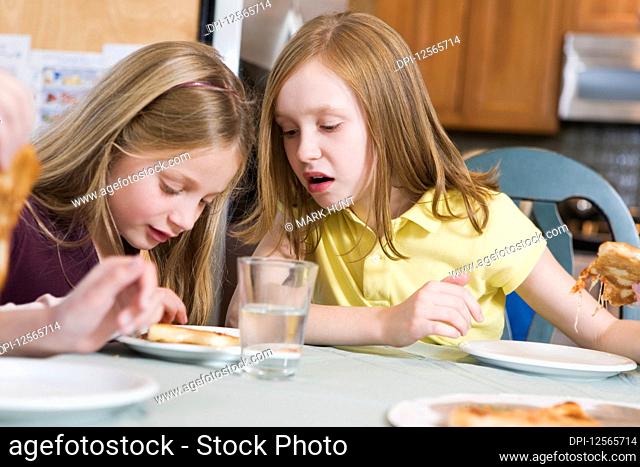 View of two girls looking at a plate
