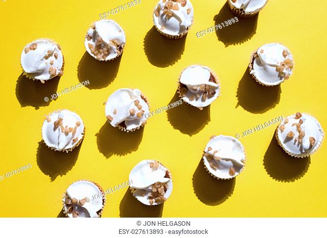 cupcakes on yellow background shot directly above