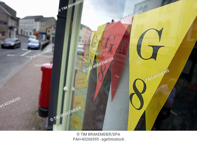 Colourful paper pennants with the lettering 'G8' hang in a shop window in Enniskillen, Northern Ireland/ Great Britain, 16 June 2013
