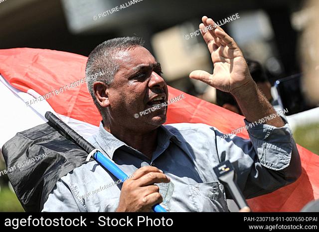 18 July 2023, Iraq, Baghdad: A protester shouts slogans during a protest near the Turkish Embassy in Baghdad, against the shortage of the water supply of...