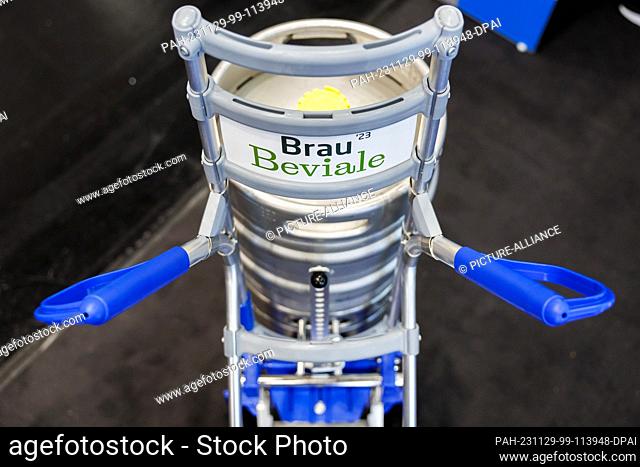 28 November 2023, Bavaria, Nuremberg: ""Brau Beviale"" is written on the sign of a sack truck at the BrauBeviale beverage trade fair on the stand of the German...