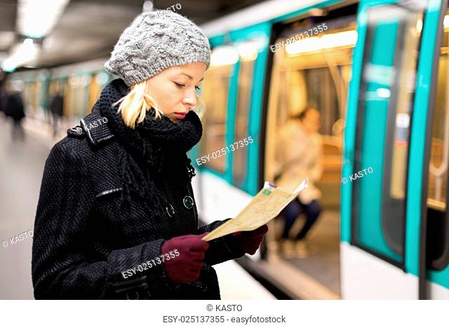 Lady waiting on subway station platform