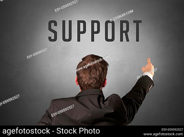 Rear view of a businessman with SUPPORT inscription, powerfull business concept