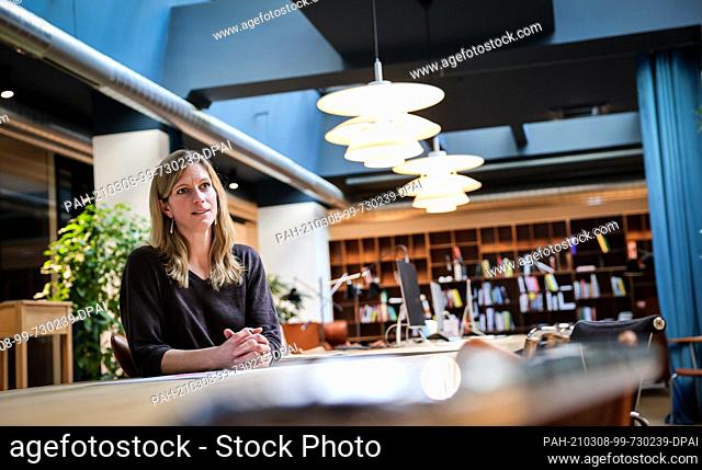 23 February 2021, Hamburg: Maja Göpel, political economist, clasps her hands during a photo opportunity at the think tank ""The New Institute""