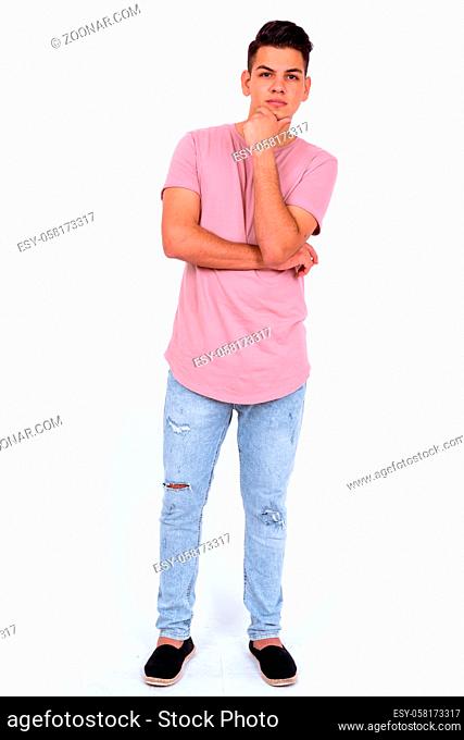 Studio shot of young handsome multi ethnic man against white background