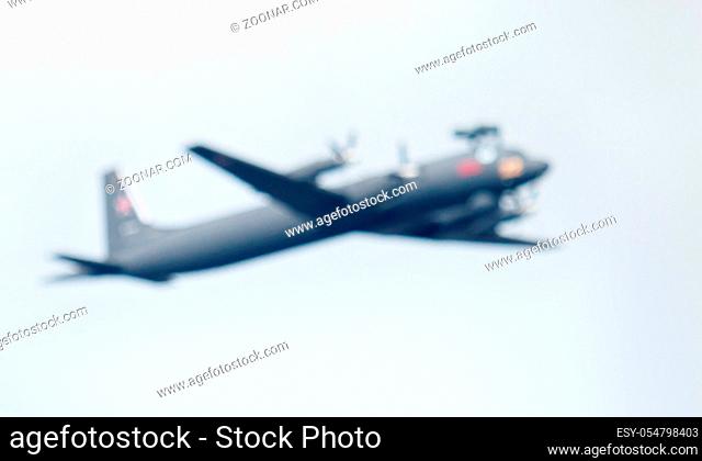 strong blurred, military aircraft in the air