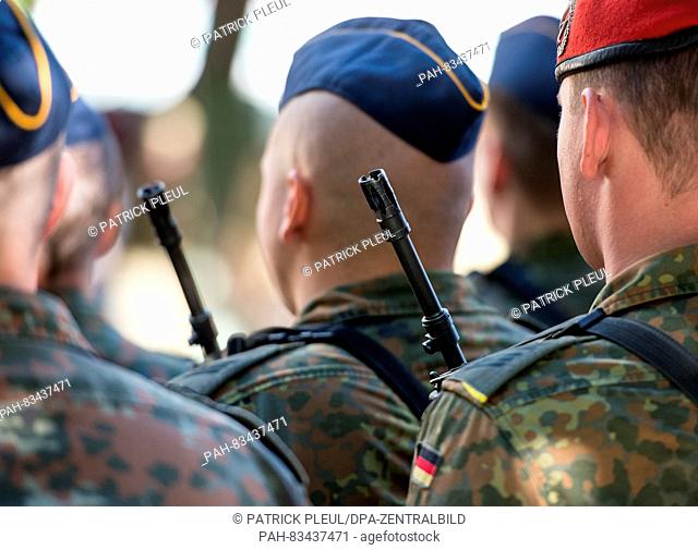 The muzzle of a G36 assault rifle from Heckler & Koch can be seen during roll call with the German Bundeswehr on the market square in Storkow,  Germany