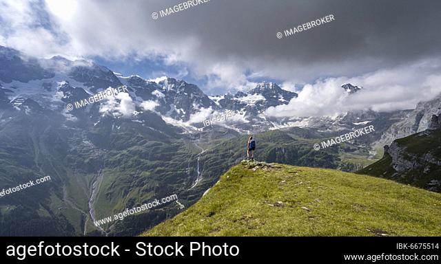 Hiker on the Tanzboden, behind Breithorn and Tschingelhorn, Lauterbrunnen, Bernese Alps, Bernese Oberland, Switzerland, Europe