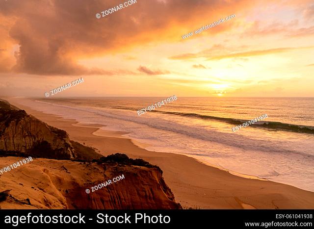 A beautiful sunset with beach and sand dunes on the Alentejo coast of Portugal