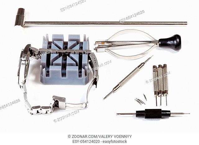watchmaker workshop - watch repairing tool kit for adjusting watchband on white background