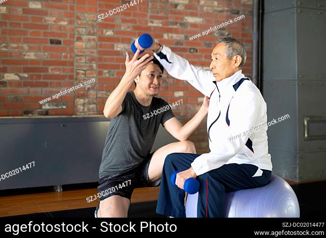 Senior man taking personal training