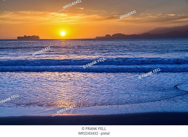 Sunset from Baker Beach overlooking Pacific Ocean at dusk, South Bay, San Francisco, California, United States of America, North America