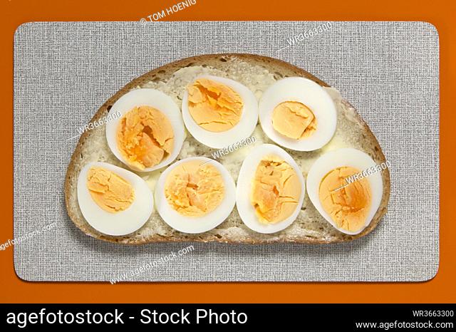 Slice of bread with eggs, elevated view