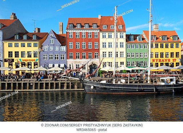 COPENHAGEN, DENMARK - AUGUST 22, 2014: The Nyhavn canal. Nyhavn is waterfront, canal and entertainment district in Copenhagen
