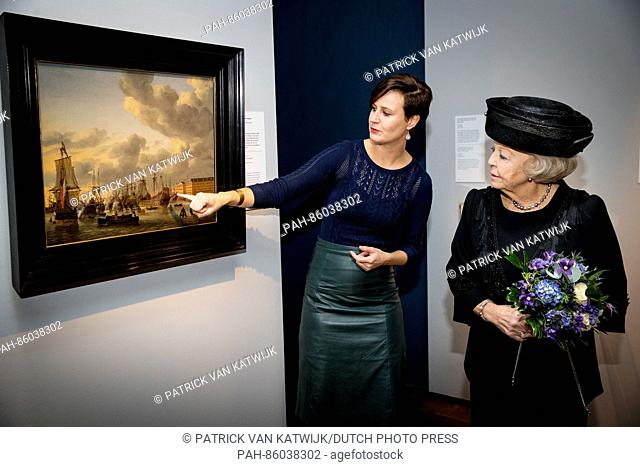 Princess Beatrix of The Netherlands at the painting Gezicht op't IJ met Lands Zeemagazijn from Reinier Nooms and the ship Huis Tijdverdrijf during her visit to...