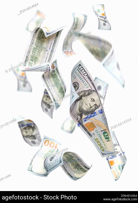 Randomly Falling $100 Bills Isolated on a White Background with Largest Bill in Focus