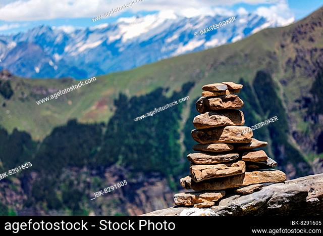 Stone cairn in Himalayas with mountains in background. Near Manali, above Kullu Valley, Himachal Pradesh, India, Asia