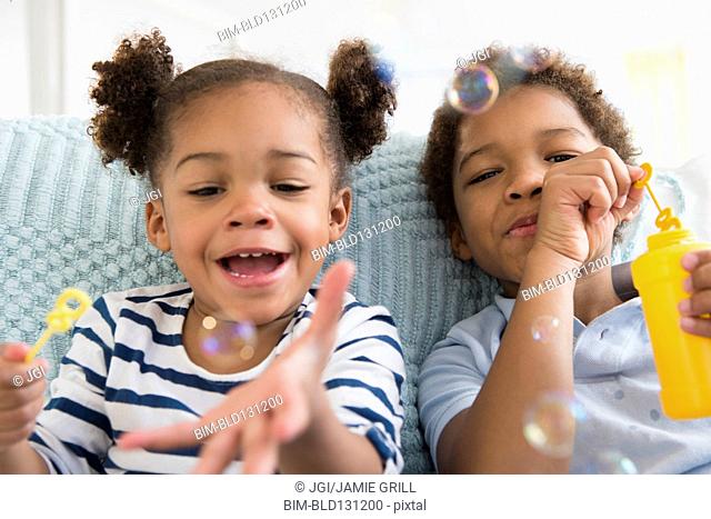 Boy And Girl Blowing Bubbles Stock Photos And Images Agefotostock