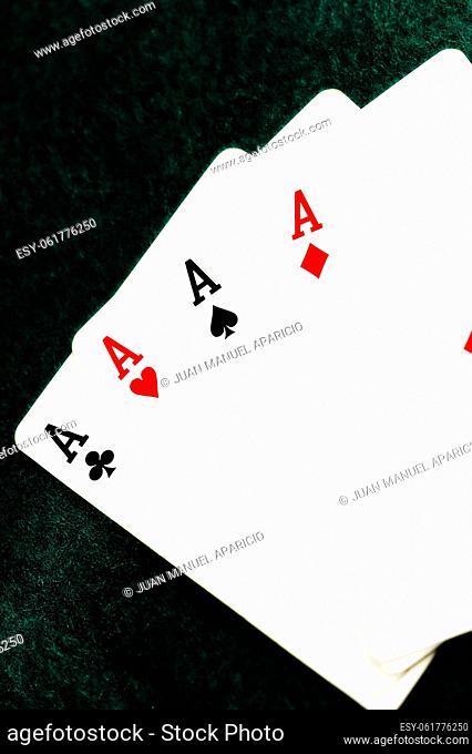 Poker of aces on black background