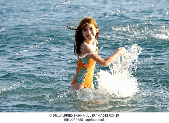 Girl splashing in the sea