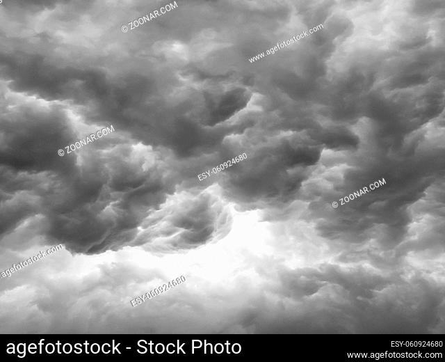Black clouds formed before the rain. Ominous storm clouds. Sky before a thunderstorm. Used to make a background image