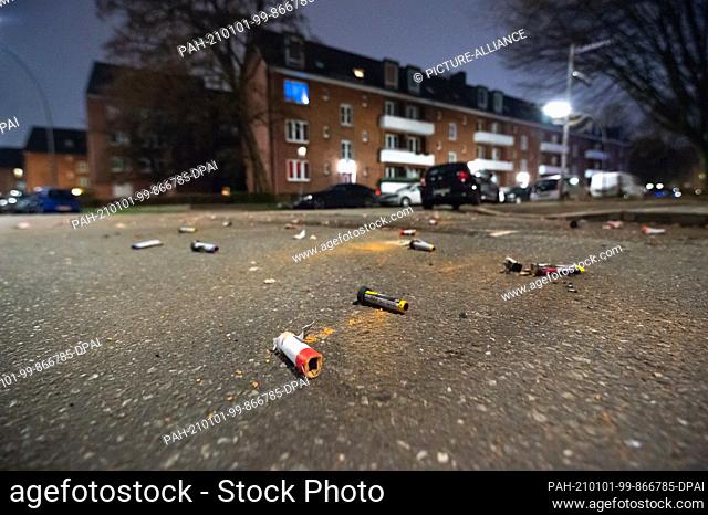 01 January 2021, Hamburg: Exploded firecracker and rocket parts lie on an intersection in a residential area on New Year's morning