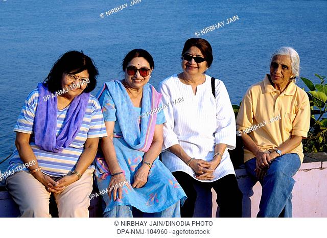 Four senior citizens women on back water at Ratnagiri  ; Maharashtra  ; India