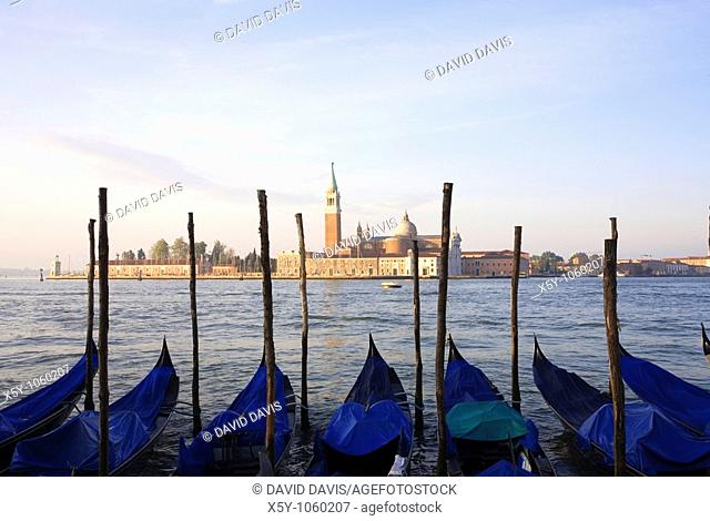 Gondola moored at Molo San Marco in Venice Italy with San Giorgio Maggiore in the background