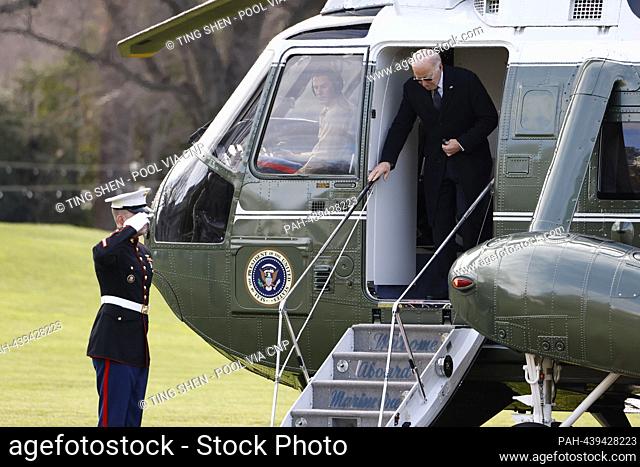United States President Joe Biden disembarks Marine One on the South Lawn of the White House in Washington, DC, US, on Tuesday, December 19, 2023