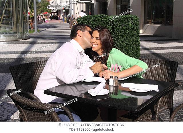 Couple kissing in lincoln road Miami Beach