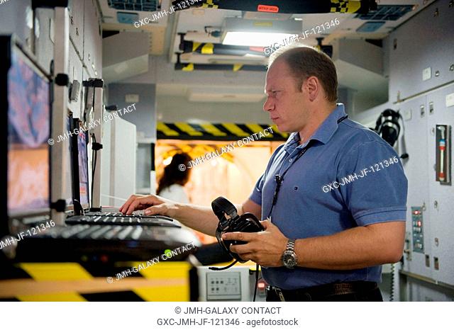 Cosmonaut Oleg Kotov, Expedition 22 flight engineer and Expedition 23 commander, participates in a training session in an International Space Station...
